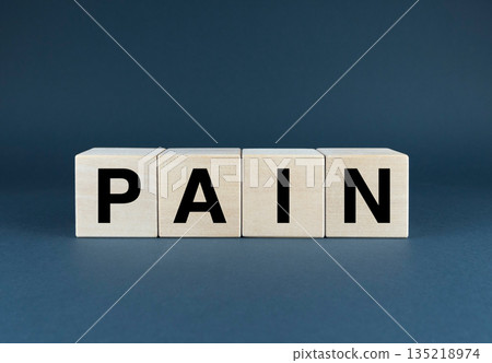 A close-up image of wooden blocks spelling out the word PAIN A close-up image of wooden blocks spelling out the word PAIN 135218974