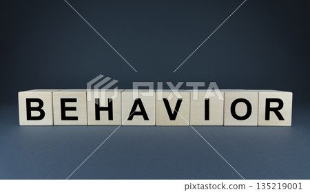 Behavior - word on cubes on a blue background Behavior - word on cubes on a blue background 135219001