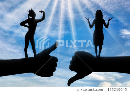 Selfishness and ego. Selfish woman with a crown who thinks she is better than another woman. Selfishness and ego. Selfish woman with a crown who thinks she is better than another woman. 135219045