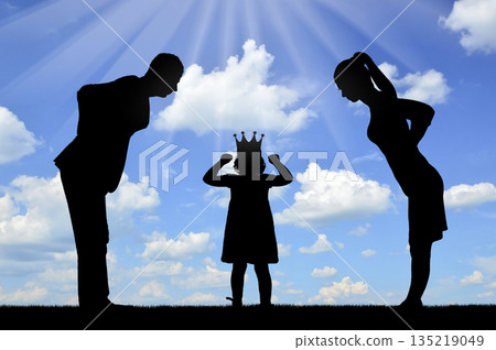 Childish selfishness and whims. Dissatisfied parents look at a selfish child girl with a crown 135219049