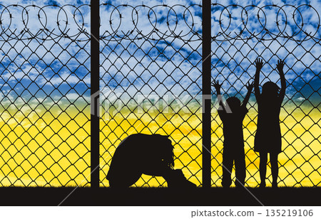 Ukrainian refugees - Family - mother and children, at the barbed wire fence Ukrainian refugees - Family - mother and children, at the barbed wire fence 135219106