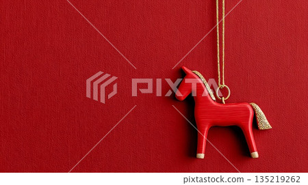 Red horse ornament hanging against textured red background for Chinese New Year celebration 135219262
