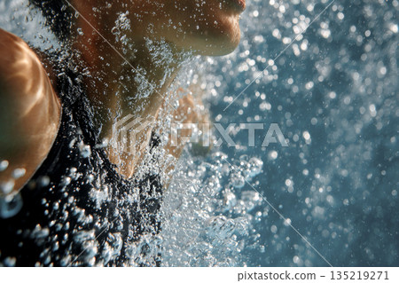 Diver emerging from water, showcasing dynamic movement and splashes in an aquatic environment Diver emerging from water, showcasing dynamic movement and splashes in an aquatic environment 135219271