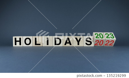 Cubes form the words Holidays 2022 - 2023. The concept and planning of holidays 135219299