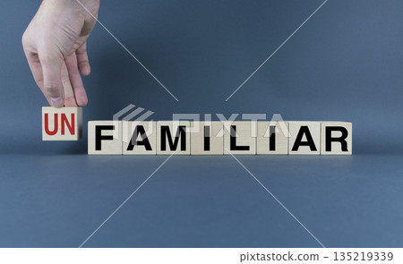 Unfamiliar or Familiar. Cubes form the words Unfamiliar or Familiar. 135219339