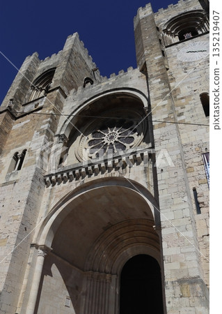 Close-up of the Romanesque facade and rose window of Lisbon Cathedral in Portugal Close-up of the Romanesque facade and rose window of Lisbon Cathedral in Portugal 135219407