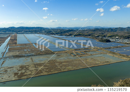 Winter in Ushimado, Okayama Prefecture: Aerial view of the Setouchi Kirei Solar Power Plant, one of Japan's largest solar power plants, located on the former Kinkai salt fields Winter in Ushimado, Okayama Prefecture: Aerial view of the Setouchi Kirei Solar Power Plant, one of Japan's largest solar power plants, located on the former Kinkai salt fields 135219570
