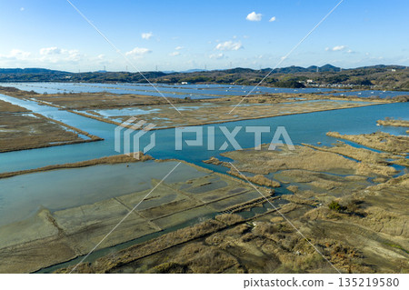 Winter in Ushimado, Okayama Prefecture: Aerial view of the Setouchi Kirei Solar Power Plant, one of Japan's largest solar power plants, located on the former Kinkai salt fields 135219580