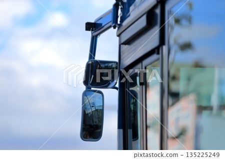 Image of a large bus side mirror 135225249