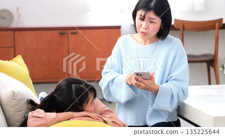 Parent-child quarrel, smartphone, long hours of gaming, studying image 135225644