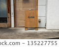 sorry we are closed sign hanging outside a restaurant, store, office or other 135227755