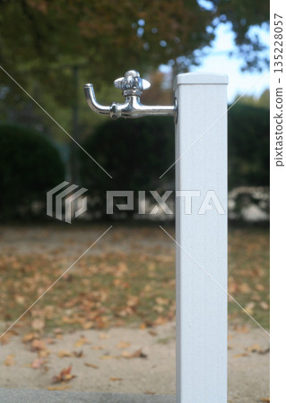 A faucet installed in a park A faucet installed in a park 135228057