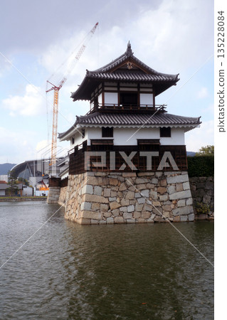 Castle turret and renovation crane 135228084