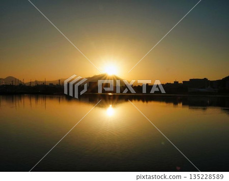 Sunrise over a quiet river Sunrise over a quiet river 135228589