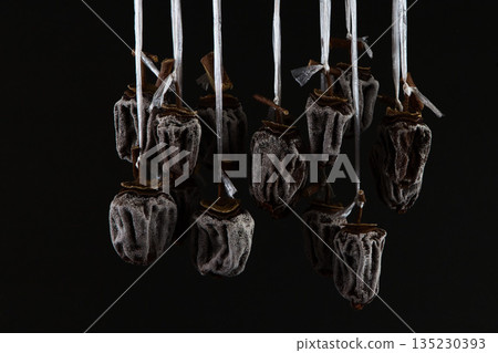 Hanging persimmons: a winter tradition 135230393