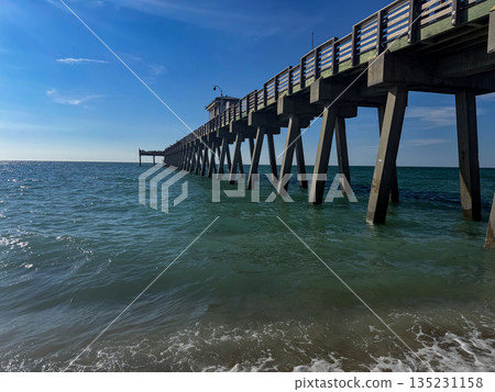 Wooden Pier Extending Over Turquoise Ocean Water 135231158
