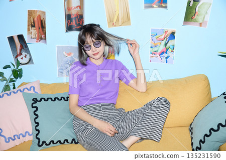 Portrait of young Asian woman enjoying her hobbies and personal time at home Portrait of young Asian woman enjoying her hobbies and personal time at home 135231590
