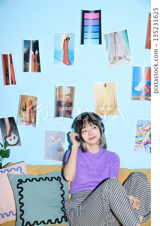 Portrait of young Asian woman enjoying her hobbies and personal time at home 135231625