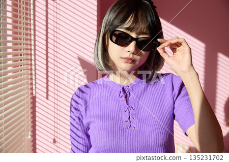 Cool portrait of a fashion-loving young Asian woman 135231702