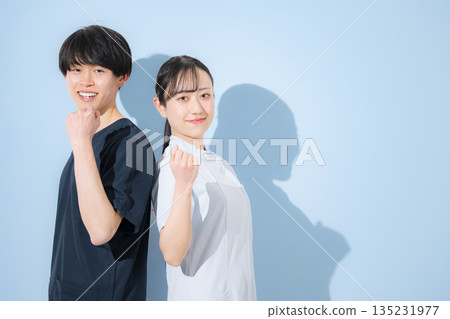 Young men and women with refreshing nurse images against a colorful background. For new graduate recruitment or job change recruitment, fist pumps and "I'll do my best" 135231977