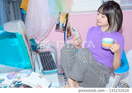 Portrait of a young freelance woman working from home Portrait of a young freelance woman working from home 135232028