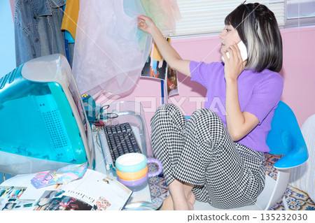 Portrait of a young freelance woman working from home Portrait of a young freelance woman working from home 135232030