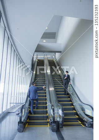 Escalator and businessman Escalator and businessman 135232393