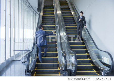 Escalator and businessman 135232394