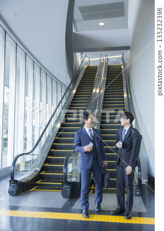 Escalator and businessman 135232396
