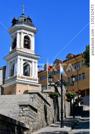 Bulgaria, Plovdiv, Church of the Holy Virgin, bell tower, street lamp, hanging flowers 135232473