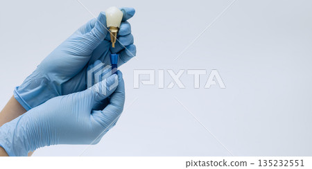Hands Assembling Dental Implant Components 135232551