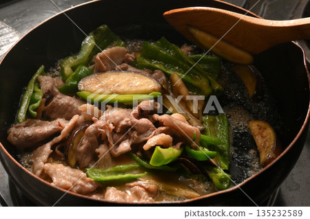 Stir-fried eggplant, green pepper, and pork with miso while cooking Stir-fried eggplant, green pepper, and pork with miso while cooking 135232589