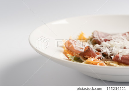 Farfalle pasta with pork coppa and parmesan cheese Farfalle pasta with pork coppa and parmesan cheese 135234221