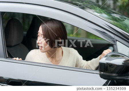 A woman driving a car A woman driving a car 135234309