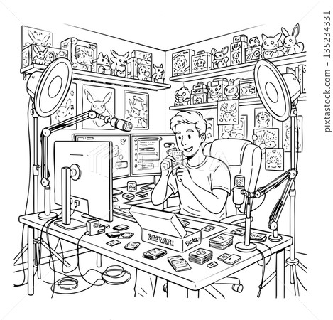 A man is sitting at a desk with a computer and a box of cards 135234331