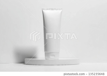White tube mockup on pedestal on white isolated background. Concept of beauty products, face and body skin care. Image for your design 135235648
