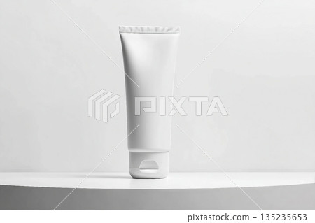 White tube mockup on pedestal on white isolated background. Concept of beauty products, face and body skin care. Image for your design White tube mockup on pedestal on white isolated background. Concept of beauty products, face and body skin care. Image for your design 135235653