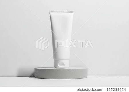 White tube mockup on pedestal on white isolated background. Concept of beauty products, face and body skin care. Image for your design White tube mockup on pedestal on white isolated background. Concept of beauty products, face and body skin care. Image for your design 135235654