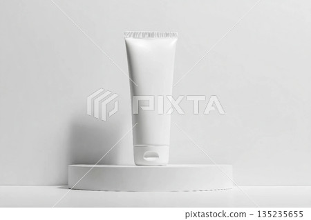 White tube mockup on pedestal on white isolated background. Concept of beauty products, face and body skin care. Image for your design White tube mockup on pedestal on white isolated background. Concept of beauty products, face and body skin care. Image for your design 135235655