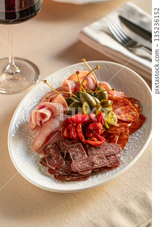 Cold cuts platter with sausages and pickles 135236152
