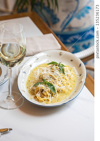 Creamy pasta with cheese and herbs on plate Creamy pasta with cheese and herbs on plate 135236173