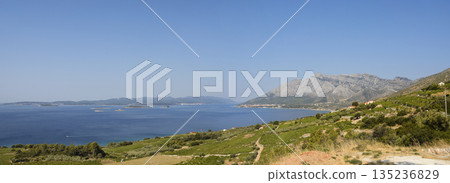 Panoramic view from Peljesac peninsula toward Korcula island and Orebic town Panoramic view from Peljesac peninsula toward Korcula island and Orebic town 135236829
