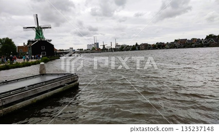 Amsterdam, Netherlands - May 26 2022: Windmill at Zaanse Schans Amsterdam, Netherlands - May 26 2022: Windmill at Zaanse Schans 135237148