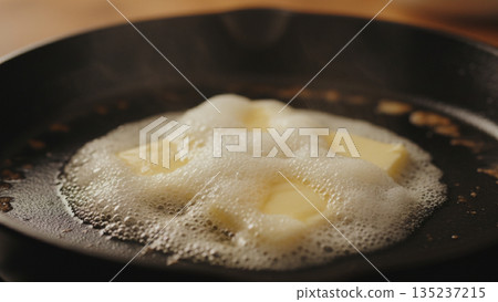 Melting Butter Foaming in Hot Pan for Cooking Process 4k ai 135237215