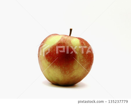 Detailed shot of apple with rustic ambiance, Vivid closeup capturing apple skin and natural imperfections Detailed shot of apple with rustic ambiance, Vivid closeup capturing apple skin and natural imperfections 135237779