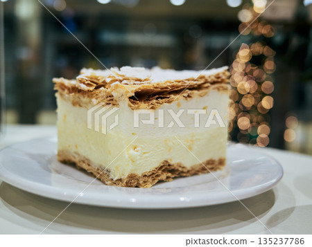Elegant pastry featuring vanilla filling and holidaythemed presentation 135237786