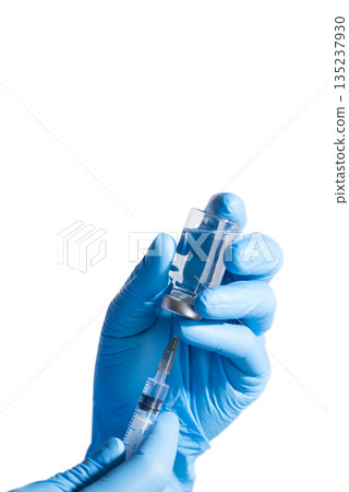 Medical Professional hands in gloves Preparing Syringe with Vial 135237930