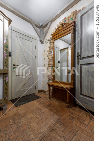 Rustic Hallway Interior with Wooden Door and Mirror Bench Rustic Hallway Interior with Wooden Door and Mirror Bench 135237948