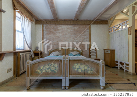 Rustic bedroom interior with hand-painted floral wooden bed Rustic bedroom interior with hand-painted floral wooden bed 135237955