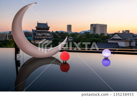 Kokura Castle and moon light bulb with reflection at sunset, Kitakyushu 135238455